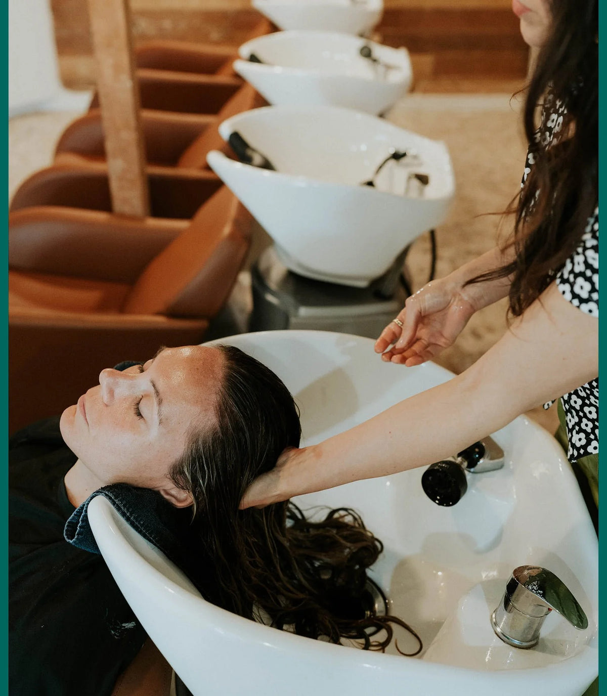 Client's hair being washed at the shampoo station at Zayda Hair & Apothecary, San Antonio TX